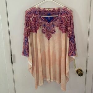Reba light peach caftan style knit top with hot pink, blue print, embellished